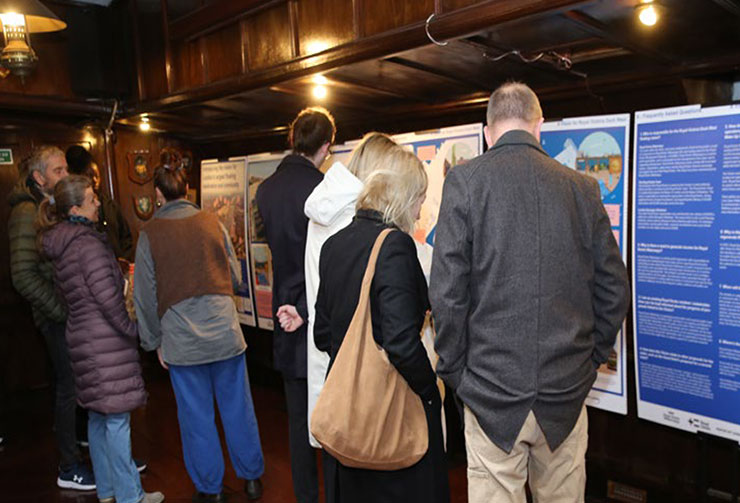 People looking at proposed plans for docks.