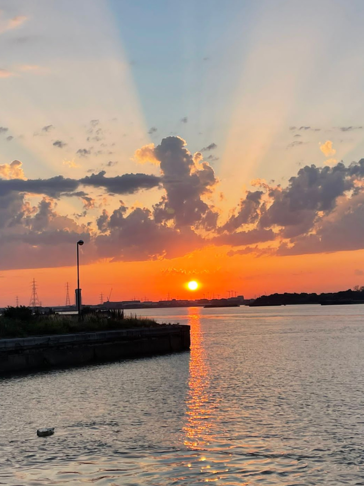 A vivid sunset over the water at the docks.